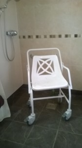 Mobile shower chair with caastors and brakes